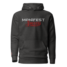 Load image into Gallery viewer, Dark gray "Manifest Success" pullover hoodie featuring a front pouch pocket and unique self-fabric patch.