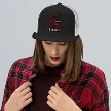 Load image into Gallery viewer, Gorilla Boss Mindset Trucker Cap worn by a model, showcasing bold style and confidence in streetwear fashion.
