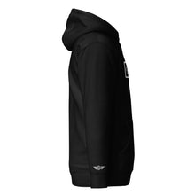 Load image into Gallery viewer, Side view of the Domin8 Daily unisex pullover hoodie in black, showcasing its stylish design and comfortable fit.
